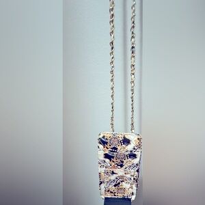 Just the cutest carrier for your phone, cards, and cash. Make me an offer!